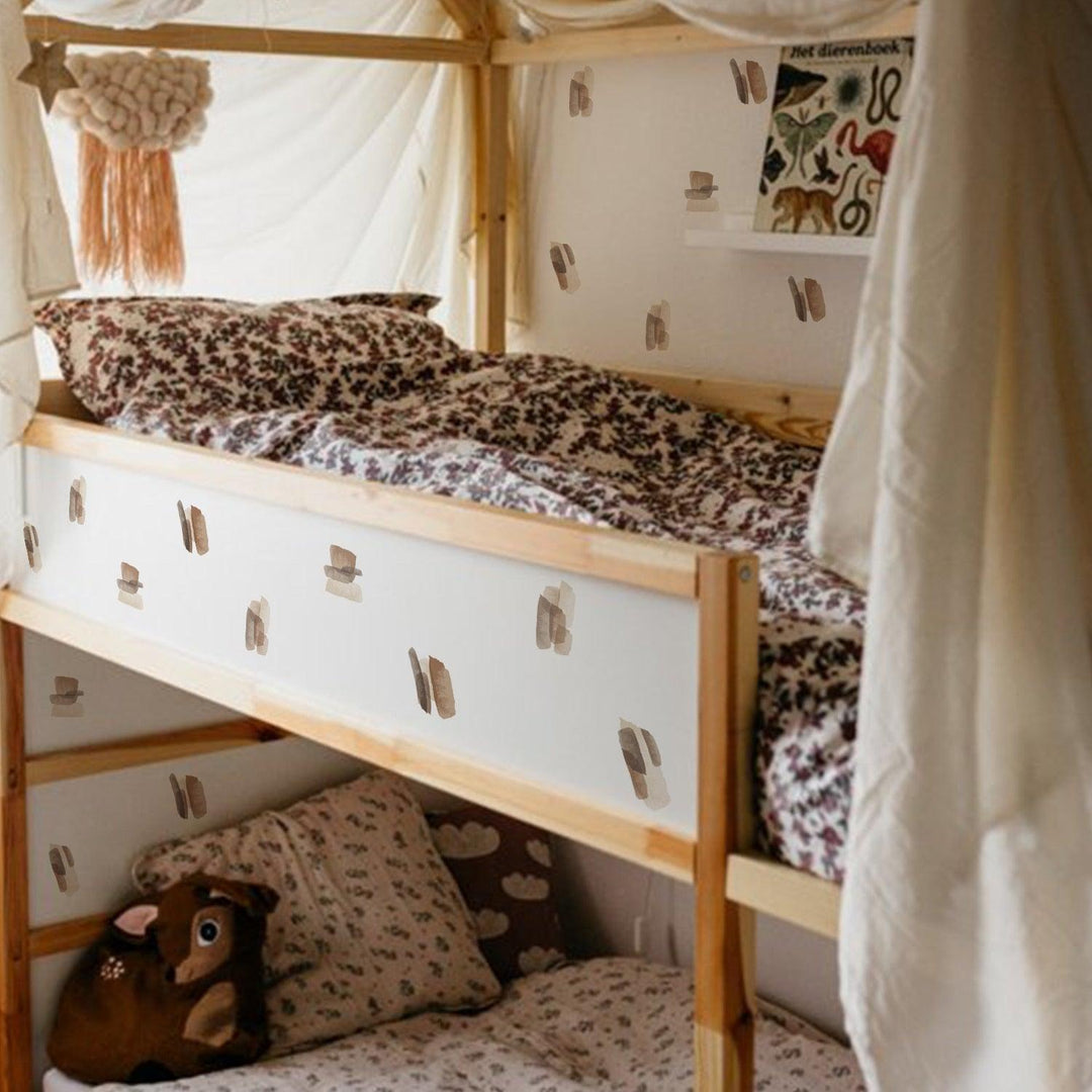 Brown and neutral color abstract lines wall decal stickers on the side of a child's bunk bed and white walls