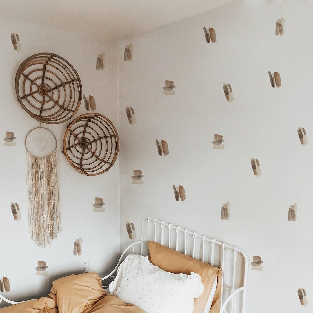 Brown and neutral color abstract lines wall decal stickers on a white wall above bed